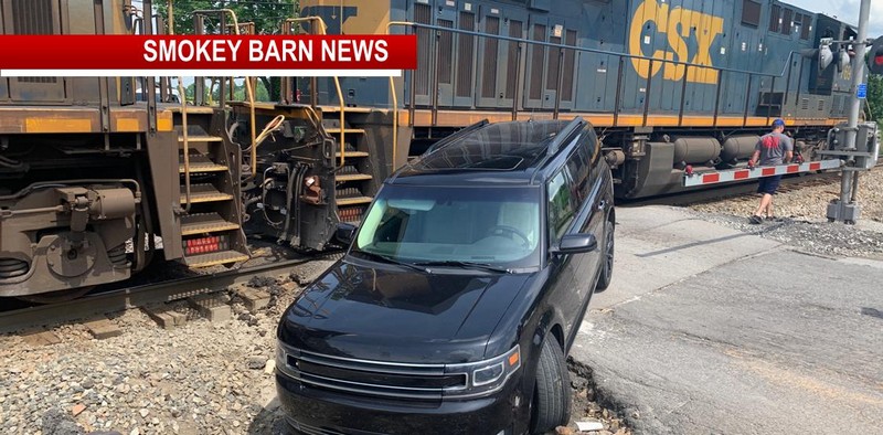 Three Escape Train After Vehicle Gets Stuck On Tracks